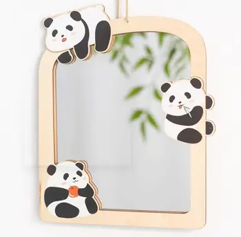 Настенное акриловое зеркало в рамке из липы в виде панды.